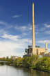 Tall chimney of powerhouse on the river Saar in Saarbrücken