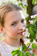 Beautiful blond girl in garden