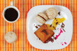 Cup of coffee, macaroons and caramel pudding still life