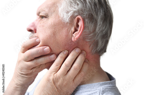 Photo: senior with neck and jaw stiffness senior with neck and jaw stiffness