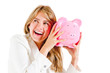 Business woman shaking a piggybank