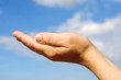 Women's open hand in the clouds