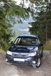 Photo: Subaru Forester on the off road track in mountains Subaru Forester on the off road track in mountains