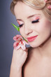 young beautiful woman with pink flower young beautiful woman with pink flower
