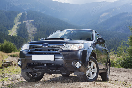 Photo: Subaru Forester on the off road track in mountains Subaru Forester on the off road track in mountains