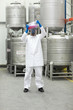 canvas print picture - Specialist in protective uniform examining sample