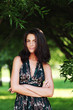 girl on a background of green trees girl on a background of green trees