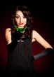 Vintage woman in retro dress with absinthe . Pin-up girl