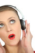 Blond woman with headphones audio