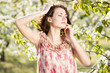 Beautiful woman in spring garden