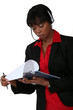Call-center supervisor with clip-board and pen