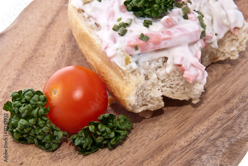 Photo: Rolls with meat salad on a cutting board Rolls with meat salad on a cutting board