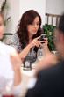 Woman in restaurant looking at mobile