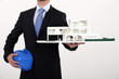 Architect with a model of a commercial development Architect with a model of a commercial development