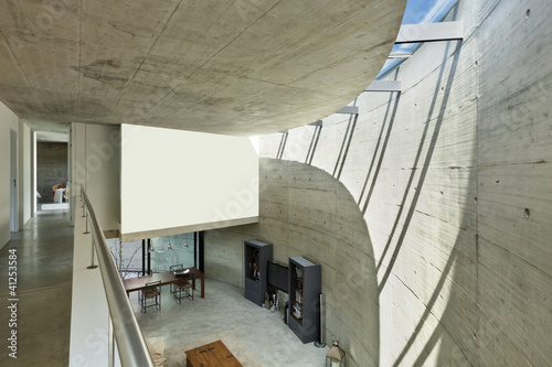 Photo: beautiful modern house in cement, interior, living room top view beautiful modern house in cement, interior, living room top view