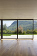 modern concrete house with hardwood floor, large window