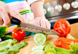 Woman's hands cutting vegetables