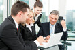 Business people - team meeting in an office Business people - team meeting in an office