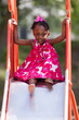 Portrait of a cute african american little girl playing at playg Portrait of a cute african american little girl playing at playg