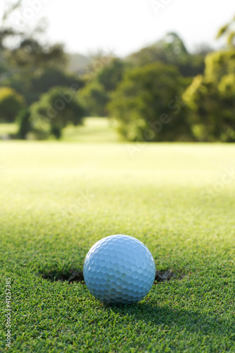 Photo: A golf ball and hole A golf ball and hole