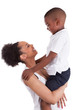 Photo: Litte black boy kissing her mother Litte black boy kissing her mother
