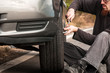 Young man repairing car