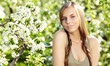 Spring woman in summer dress walking in park Spring woman in summer dress walking in park