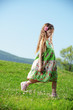 Little girl at green field