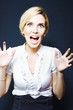 Attractive business woman screaming in terror