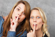Amazed girls hushing - shh
