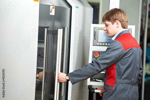 Photo: laborer worker with machining tool center laborer worker with machining tool center