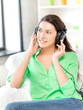 happy teenage girl in big headphones