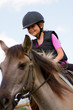 Horse riding - portrait of lovely equestrian on a horse