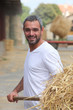 farmer removing hay
