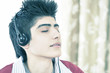 Photo: Teenage boy lost in music with headphones Teenage boy lost in music with headphones