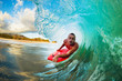 Body Boarder on Large Wave Surfing in the Tube Getting Barreled