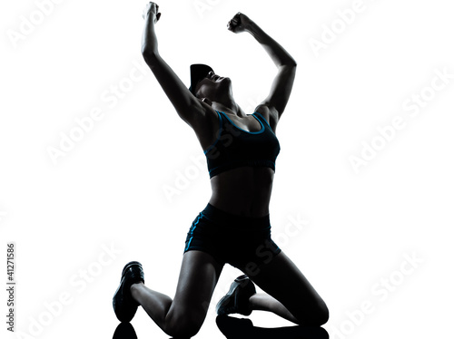 Photo: woman runner jogger kneeling winner victory woman runner jogger kneeling winner victory
