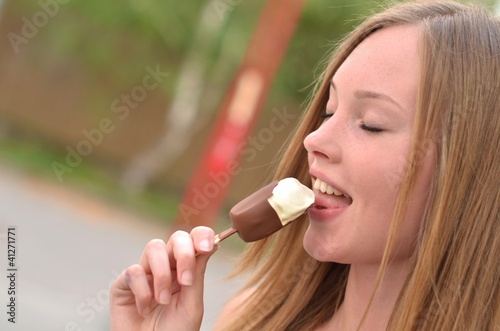 Photo: woman eating ice cream woman eating ice cream