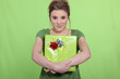 Woman in green with a green present