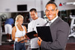 confident gym manager and staff