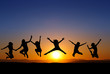 silhouette of kids jumping on beach in sunset silhouette of kids jumping on beach in sunset