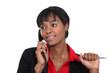 Businesswoman making a call to customer