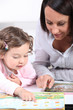 Mother and daughter reading books