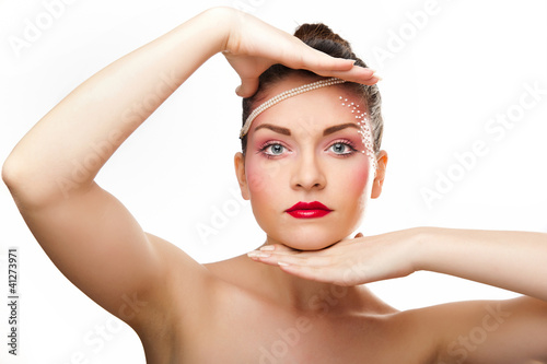 Photo: Young brunette lady with makeup isolated on white background Young brunette lady with makeup isolated on white background