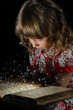 Teen girl reading the Book.