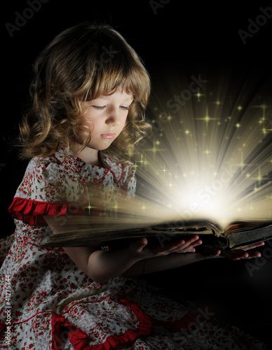 Photo: Teen girl reading the Book. Teen girl reading the Book.