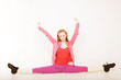 girl  siting on gym split on white background