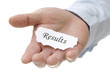 Businessman holding results note Businessman holding results note