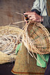 Older hands making a wicker basket