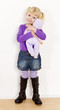little girl playing with a doll